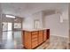 Spacious kitchen with island, wood cabinets, modern countertops, and plank flooring at 1036 Kennebunk Cir, Henderson, NV 89015