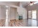 Bright living room showcasing a fireplace, ceiling fan, and access to the outdoor patio at 1036 Kennebunk Cir, Henderson, NV 89015