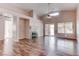 Open-concept living room with high ceilings, skylight, and sliding door to outdoor space at 1036 Kennebunk Cir, Henderson, NV 89015