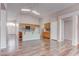 Open-concept living space with vaulted ceilings, natural light, and seamless kitchen access at 1036 Kennebunk Cir, Henderson, NV 89015