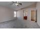 Spacious main bedroom with a ceiling fan and an ensuite bathroom, providing a relaxing retreat at 1036 Kennebunk Cir, Henderson, NV 89015