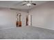 Large main bedroom featuring a ceiling fan, neutral tones, and convenient access to the ensuite bathroom at 1036 Kennebunk Cir, Henderson, NV 89015