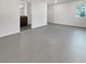 Spacious living room featuring hard floors, ample natural light and neutral walls at 10537 Headwind Ave, Las Vegas, NV 89129