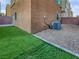 The property has a well-maintained backyard with artificial grass and a gravel area at 10537 Headwind Ave, Las Vegas, NV 89129