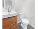 Modern bathroom featuring a floating vanity with sleek hardware and a frameless mirror at 10537 Headwind Ave, Las Vegas, NV 89129