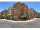 Modern three-story home showcasing a contemporary design, tidy landscaping, and an attached garage at 10537 Headwind Ave, Las Vegas, NV 89129