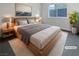 Serene main bedroom featuring a cozy bed, modern furniture, and neutral decor at 10537 Headwind Ave, Las Vegas, NV 89129