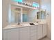 Elegant bathroom featuring double sinks, stylish fixtures, and ample counter space for a luxurious experience at 10580 Riva Grande Ct, Las Vegas, NV 89135