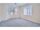 Spacious bedroom with neutral carpet and large windows at 10580 Riva Grande Ct, Las Vegas, NV 89135