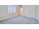 Bedroom featuring plush carpet, a window and a closet at 10580 Riva Grande Ct, Las Vegas, NV 89135