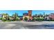 Stunning clubhouse featuring colorful architecture, a grand entrance, and professionally landscaped grounds at 10580 Riva Grande Ct, Las Vegas, NV 89135