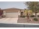 Charming single-story home with a two-car garage and well-maintained front yard landscaping at 10580 Riva Grande Ct, Las Vegas, NV 89135