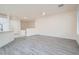 Spacious, well-lit living room with modern flooring and ample space at 10580 Riva Grande Ct, Las Vegas, NV 89135
