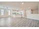 Bright and spacious living room with modern flooring and an open kitchen layout at 10580 Riva Grande Ct, Las Vegas, NV 89135