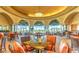 Relaxing resident lounge area featuring comfortable seating, large windows with views, and stylish lighting at 10580 Riva Grande Ct, Las Vegas, NV 89135