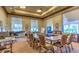 Functional meeting room with a large conference table, comfortable chairs, and natural light at 10580 Riva Grande Ct, Las Vegas, NV 89135
