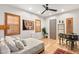 Cozy bedroom with natural light, a writing desk, hardwood floors, and an inviting, comfortable design at 11680 Evergreen Creek Ln, Las Vegas, NV 89135