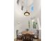 Charming dining area with high ceilings, custom lighting, and great natural light at 11680 Evergreen Creek Ln, Las Vegas, NV 89135