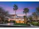 Charming home featuring a well-manicured lawn, elegant landscaping, and a welcoming facade at 11680 Evergreen Creek Ln, Las Vegas, NV 89135