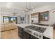 Open concept kitchen with stainless steel appliances, marble counters and eat-in area at 11680 Evergreen Creek Ln, Las Vegas, NV 89135