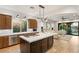 Well-lit kitchen with a center island, stainless steel appliances, and hardwood flooring at 11680 Evergreen Creek Ln, Las Vegas, NV 89135