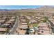 An expansive aerial view of a neighborhood, highlighting the serene, mountain backdrop at 11834 Albissola Ave, Las Vegas, NV 89138