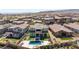 Expansive aerial view of a house with a pool and spa against a desert landscape at 11834 Albissola Ave, Las Vegas, NV 89138