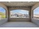 Covered balcony features stylish lighting and nice neighborhood views at 11834 Albissola Ave, Las Vegas, NV 89138