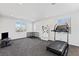 Spacious bonus room with carpeted floors, recessed lights, and large windows providing ample natural light at 11834 Albissola Ave, Las Vegas, NV 89138