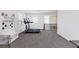 Bright bonus room with carpet and bench offers natural light from the window at 11834 Albissola Ave, Las Vegas, NV 89138