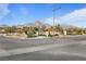 Community sign in front of mountain views and mature landscaping at 11834 Albissola Ave, Las Vegas, NV 89138