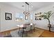 Bright dining room with modern light fixture and view of the outdoors through plantation shutters at 11834 Albissola Ave, Las Vegas, NV 89138