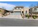 Stunning two-story home featuring a three-car garage, neutral stucco, and stone accents on a beautifully landscaped lot at 11834 Albissola Ave, Las Vegas, NV 89138