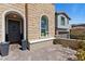 Beautiful stone facade with arched doorway and manicured plants at 11834 Albissola Ave, Las Vegas, NV 89138