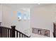 Bright hallway with staircase features three windows with beautiful outside views at 11834 Albissola Ave, Las Vegas, NV 89138