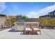Outdoor kitchen boasts a built-in grill, counter space, and seating for entertainment at 11834 Albissola Ave, Las Vegas, NV 89138