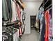 Organized walk-in closet with built-in shelving and hanging racks for ample storage at 11834 Albissola Ave, Las Vegas, NV 89138