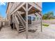 Exterior view of the backyard deck, stairway, artificial turf and stamped concrete patio at 140 Rolling Cove Ave, Henderson, NV 89011