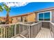 Exterior shot of the balcony, railings, and a peek at nearby properties at 140 Rolling Cove Ave, Henderson, NV 89011