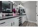 Elegant bathroom with double vanity, granite countertop, and modern fixtures at 140 Rolling Cove Ave, Henderson, NV 89011