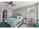 Cozy bedroom featuring a decorative bed, stylish furniture, and ample natural light at 140 Rolling Cove Ave, Henderson, NV 89011