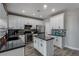 Well-equipped kitchen with stainless steel appliances, granite countertops, backsplash, and a central island at 140 Rolling Cove Ave, Henderson, NV 89011