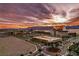 Breathtaking aerial view of a vibrant city landscape with stunning sunset and mountain backdrop at 1452 Melodic Lark Ln, Las Vegas, NV 89138