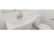 Modern bathroom with a pedestal sink and toilet at 1452 Melodic Lark Ln, Las Vegas, NV 89138