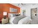 Bedroom featuring a decorative accent wall, neutral decor, and an ensuite closet at 1452 Melodic Lark Ln, Las Vegas, NV 89138