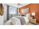Bedroom featuring a decorative accent wall, access to balcony and neutral decor at 1452 Melodic Lark Ln, Las Vegas, NV 89138