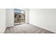 An airy bedroom with sliding glass door to a balcony at 1452 Melodic Lark Ln, Las Vegas, NV 89138