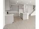 Modern kitchen with gray cabinets, an island with a sink, and stainless steel appliances at 1452 Melodic Lark Ln, Las Vegas, NV 89138