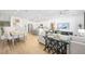 Open concept living space featuring light, modern finishes and wood-look floors at 1452 Melodic Lark Ln, Las Vegas, NV 89138