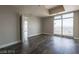 Bedroom featuring hardwood floors, large windows, and ample closet space at 150 N Las Vegas Blvd # 804, Las Vegas, NV 89101